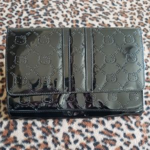 Hello Kitty x Loungefly pattern vinyl clutch bag